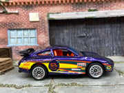 Loose Hot Wheels Porsche 911 GT3 CUP Dressed in Purple, Red, Yellow and Green