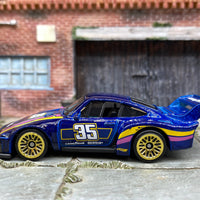 Loose Hot Wheels - Porsche 935 - Blue, Yellow and Pink Goodyear 35