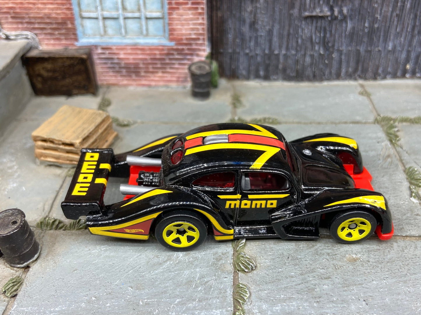 Loose Hot Wheels: VW Volkswagen Kafer Racer Race Car Dressed in Momo Black, Red and Yellow Livery