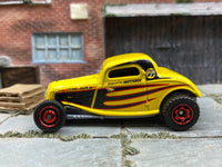 Matchbox 1933 Ford Coupe Yellow, Black and Red Mooneyes Livery - rear angle view showing tampo details