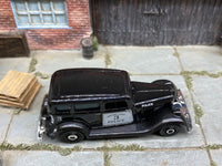 Matchbox 1933 Plymouth Black and White Police - rear angle view showing tampo details