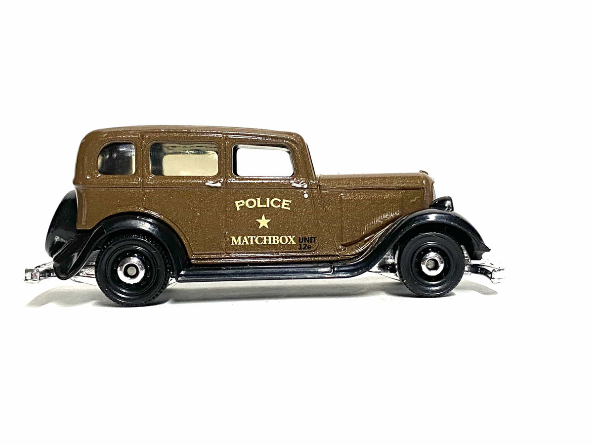 Matchbox 1933 Plymouth brown Police livery loose diecast - gallery image 1 of 3