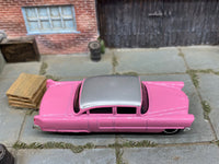 Matchbox 1955 Cadillac Fleetwood Pink and Silver - rear angle view showing tampo details
