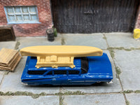 Matchbox 1959 Chevy Station Wagon Blue with a Boat - rear angle view showing tampo details