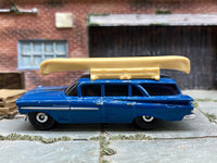 Matchbox 1959 Chevy Station Wagon Blue with a Boat loose diecast - side profile detail shot
