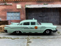Matchbox 1959 Dodge Coronet Police Car Green National Parks - rear angle view showing tampo details