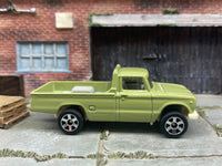 Matchbox 1962 Nissan Junior Mini Truck Green - rear angle view showing tampo details
