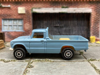 Matchbox 1962 Nissan Junior Mini Truck Light Blue - rear angle view showing tampo details