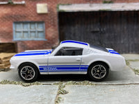 Matchbox 1965 Ford Mustang GT (Fastback) White and Blue - rear angle view showing tampo details