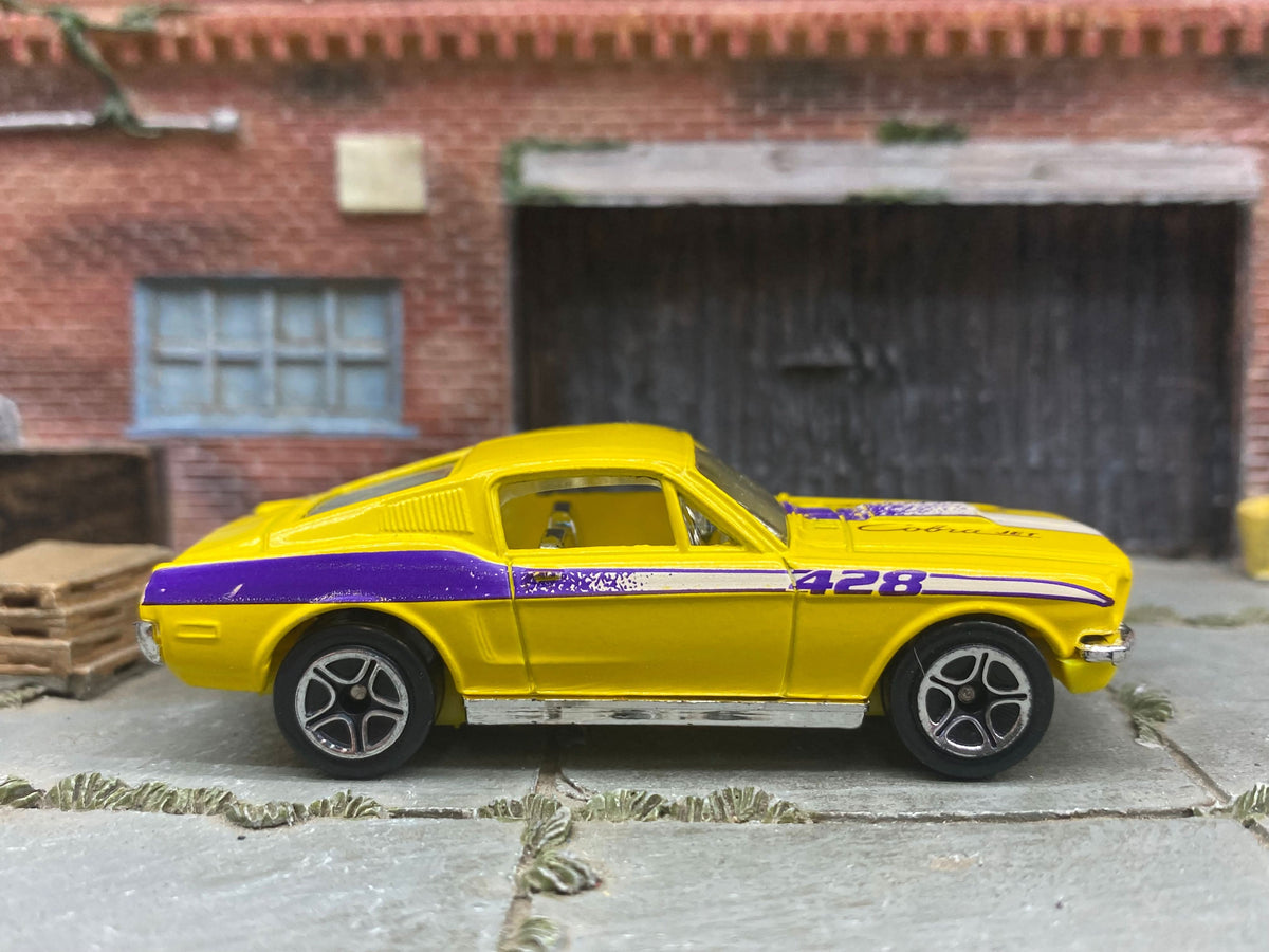 Matchbox 1968 Ford Mustang Cobra Jet 428 in Yellow and Purple, loose diecast car