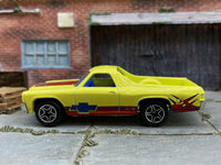 Matchbox 1970 Chevy El Camino Yellow and Burgundy - rear angle view showing tampo details