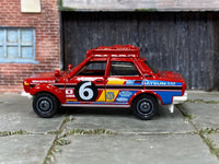Matchbox 1970 Datsun 510 Rally Car Red - rear angle view showing tampo details