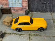Matchbox 1971 MGB GT Coupe Yellow loose diecast - side profile detail shot