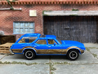 Matchbox 1971 Oldsmobile Vista Cruiser Blue - rear angle view showing tampo details