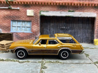 Matchbox 1971 Oldsmobile Vista Cruiser Brown - rear angle view showing tampo details