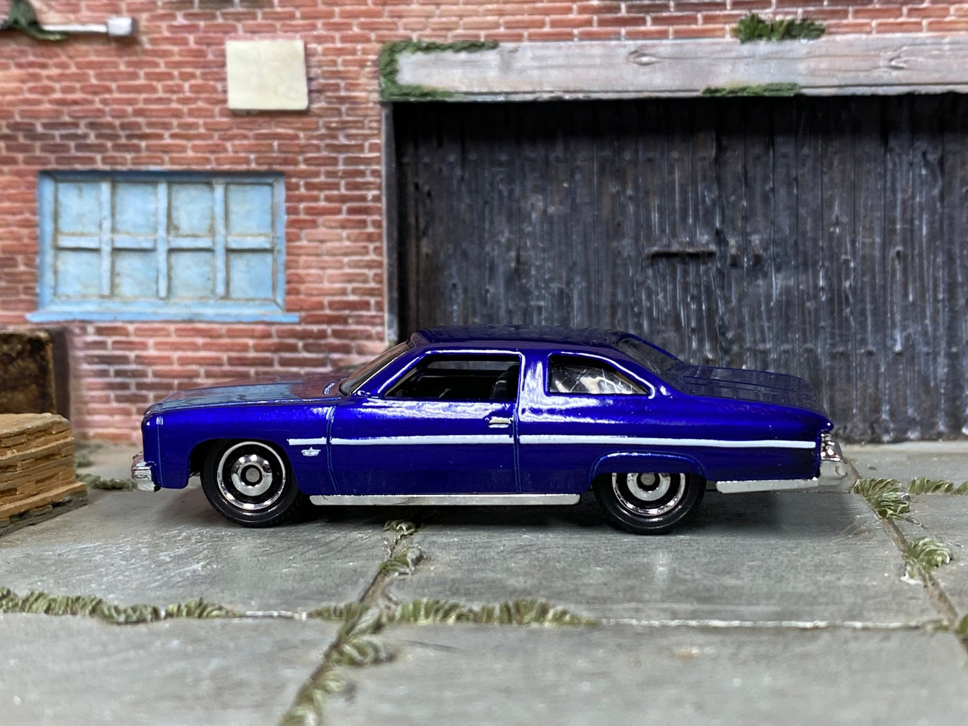 Loose Matchbox 1975 Chevrolet Caprice Classic in Dark Blue - front three-quarter view 1:64 scale diecast
