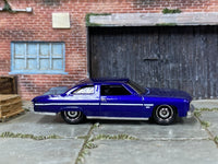 Matchbox 1975 Chevrolet Caprice Classic Dark Blue - rear angle view showing tampo details