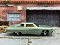 Matchbox 1975 Chevrolet Caprice Classic Green - rear angle view showing tampo details