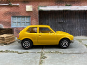 Matchbox 1976 Honda CVCC Mustard - rear angle view showing tampo details