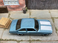 Matchbox 1979 Chevy Nova Blue and White - rear angle view showing tampo details