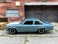 Matchbox 1979 Chevy Nova Blue and White loose diecast - side profile detail shot