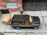 Matchbox 1989 Jeep Wagoneer Dark Gray loose diecast - side profile detail shot