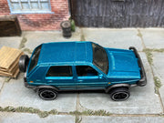 Matchbox 1990 VW Volkswagen Golf Teal loose diecast - side profile detail shot