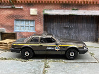 Matchbox 1993 Ford Mustang LX SSP Coupe Brown and Black Boone County Sheriff - rear angle view showing tampo details