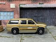 Matchbox 2000 Chevy Suburban Gold Boone County Sheriff - rear angle view showing tampo details
