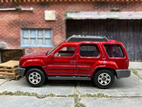 Matchbox 2000 Nissan XTerra Red - rear angle view showing tampo details