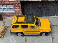 Matchbox 2000 Nissan XTerra Yellow loose diecast - side profile detail shot