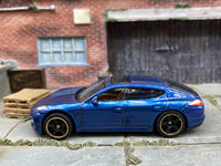 Matchbox 2010 Porsche Panamera Blue - rear angle view showing tampo details