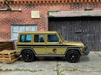 Matchbox 2014 Mercedes Benz G-Class Off Road Jurassic Park Brown - rear angle view showing tampo details