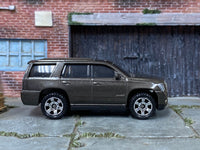 Matchbox 2015 Cadillac Escalade Dark Gray - rear angle view showing tampo details