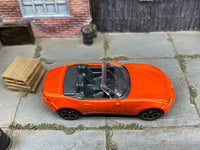 Matchbox 2015 Mazda MX-5 Miata Orange loose diecast - side profile detail shot