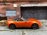 Matchbox 2015 Mazda MX-5 Miata Orange - rear angle view showing tampo details