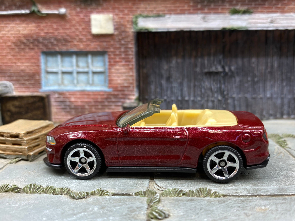 Loose Matchbox 2018 Ford Mustang Convertible in Dark Red and Tan - front three-quarter view 1:64 scale diecast