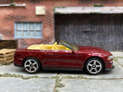 Matchbox 2018 Ford Mustang Convertible Dark Red and Tan - rear angle view showing tampo details
