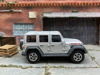 Matchbox 2018 Jeep Wrangler JL 4 Door White - rear angle view showing tampo details