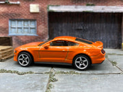 Matchbox 2019 Ford Mustang Coupe Orange - rear angle view showing tampo details