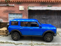 Matchbox 2021 Ford Bronco 4X4 Blue - rear angle view showing tampo details