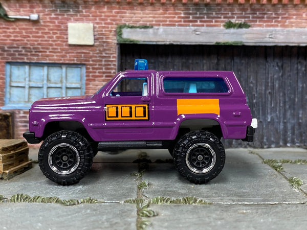 Matchbox 4X4 Chevy Blazer in Purple and Orange, loose diecast car