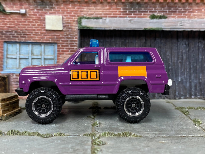 Matchbox 4X4 Chevy Blazer in Purple and Orange, loose diecast car