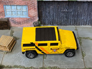 Matchbox Hummer H2 SUV Concept Yellow beach Patrol loose diecast - side profile detail shot
