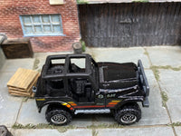 Matchbox Jeep 4X4 Black, Orange, Yellow and Red loose diecast - side profile detail shot