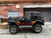 Matchbox Jeep 4X4 Black, Orange, Yellow and Red - rear angle view showing tampo details