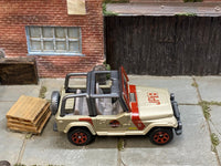 Matchbox Jeep Wrangler Jurassic Park Tour Jeep gold and red loose diecast - gallery image 2 of 3