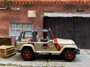 Matchbox Jeep Wrangler Jurassic Park Tour Jeep gold and red loose diecast - gallery image 3 of 3