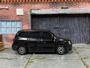 Matchbox LEVC TX Taxi Black - rear angle view showing tampo details