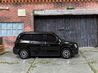 Matchbox LEVC TX Taxi Black - rear angle view showing tampo details